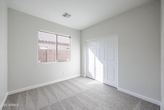 unfurnished bedroom with light carpet