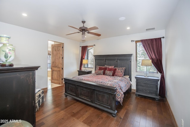 bedroom featuring baseboards, multiple windows, visible vents, and dark wood-style flooring
