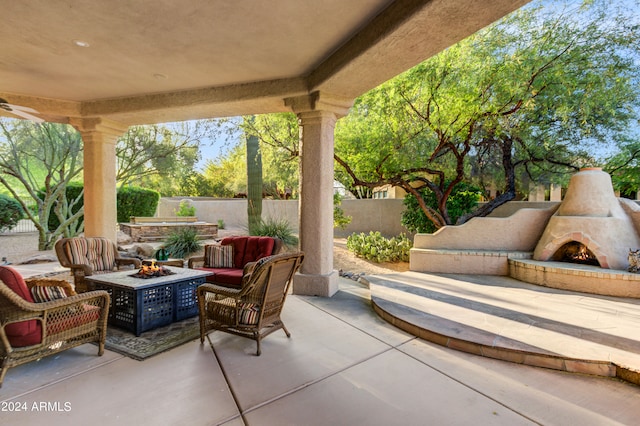 view of patio / terrace with exterior fireplace