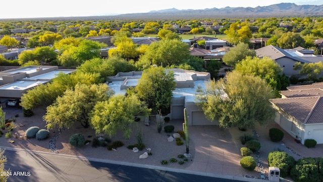 birds eye view of property featuring a mountain view