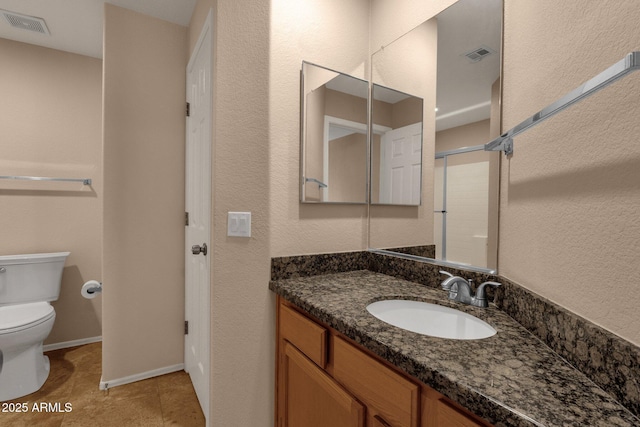 7101 W Beardsley Rd Unit 1502, Glendale, AZ 85308 - full bath featuring toilet, vanity, tile patterned flooring, a textured wall, and baseboards