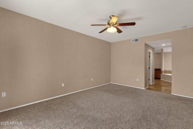 7101 W Beardsley Rd Unit 1502, Glendale, AZ 85308 - spare room with carpet flooring, a ceiling fan, and baseboards