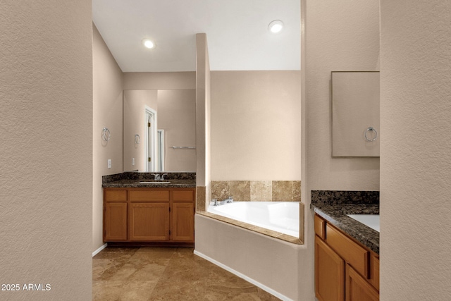 7101 W Beardsley Rd Unit 1502, Glendale, AZ 85308 - full bathroom featuring a textured wall, a bath, and two vanities