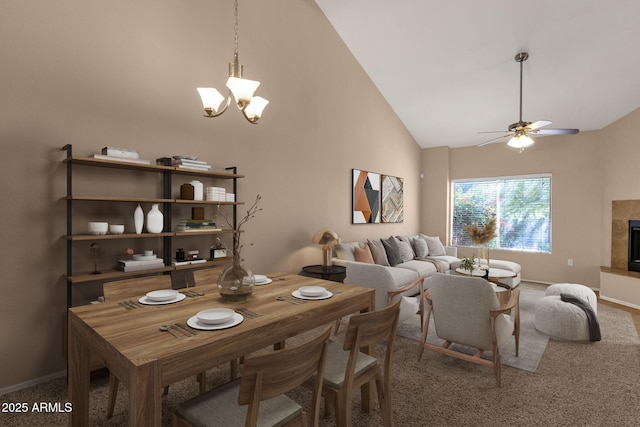 7101 W Beardsley Rd Unit 1502, Glendale, AZ 85308 - carpeted dining area with high vaulted ceiling, a chandelier, baseboards, ceiling fan, and a fireplace