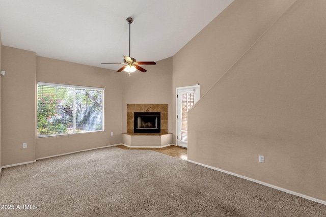 7101 W Beardsley Rd Unit 1502, Glendale, AZ 85308 - unfurnished living room featuring ceiling fan, a tiled fireplace, carpet flooring, and baseboards
