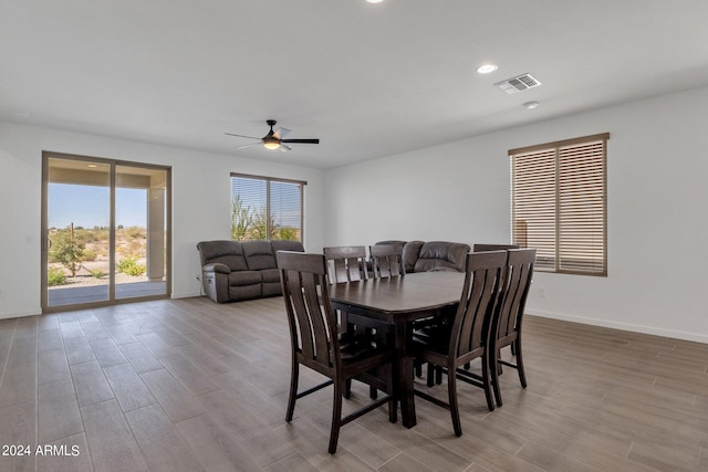 dining area with light hardwood / wood-style floors and ceiling fan