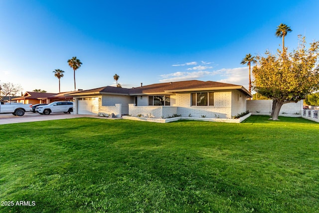 ranch-style home featuring a front lawn and a garage