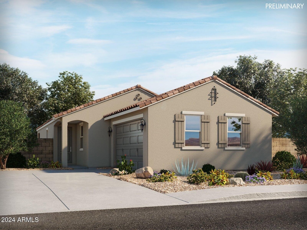 mediterranean / spanish house featuring a garage