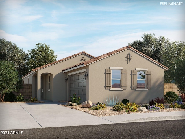 mediterranean / spanish house featuring a garage