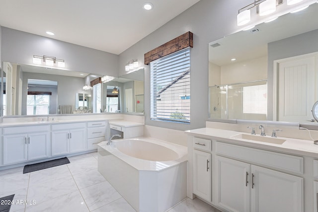 bathroom with shower with separate bathtub and vanity