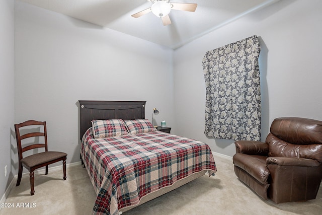 bedroom featuring ceiling fan and light carpet