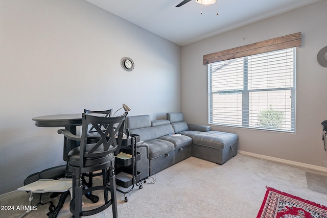 living room featuring ceiling fan and light colored carpet