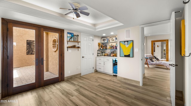 4450 E Camelback Rd Unit 4, Phoenix, AZ 85018 - interior space with a ceiling fan, french doors, a bar, light wood-style floors, and recessed lighting