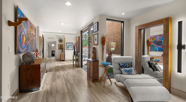 4450 E Camelback Rd Unit 4, Phoenix, AZ 85018 - hallway with an inviting chandelier, recessed lighting, and baseboards