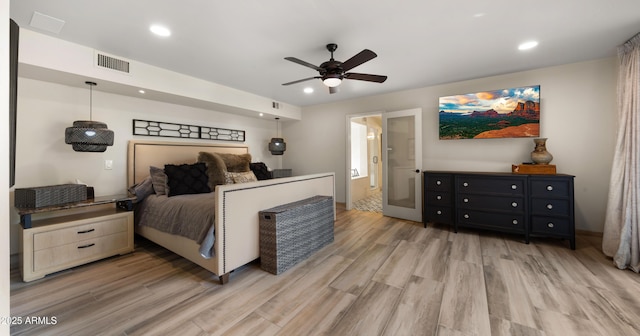 4450 E Camelback Rd Unit 4, Phoenix, AZ 85018 - bedroom featuring recessed lighting, ceiling fan, visible vents, and light wood-style floors