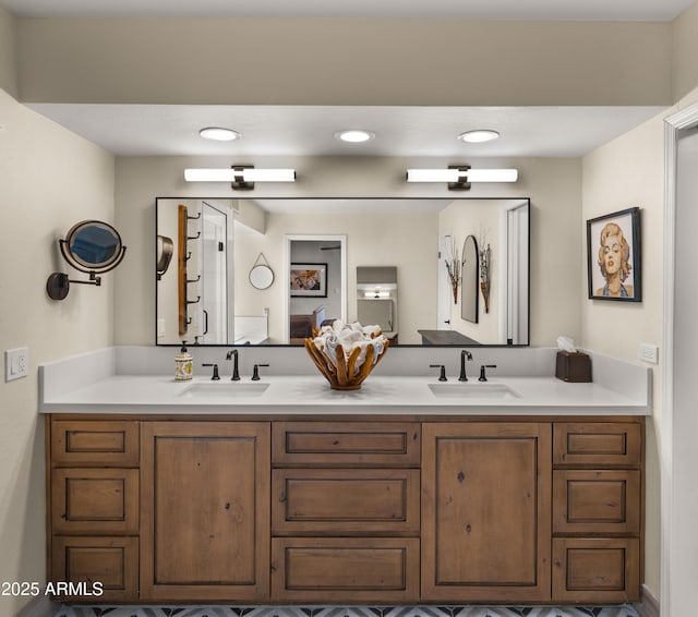 4450 E Camelback Rd Unit 4, Phoenix, AZ 85018 - bathroom featuring double vanity, recessed lighting, and a sink