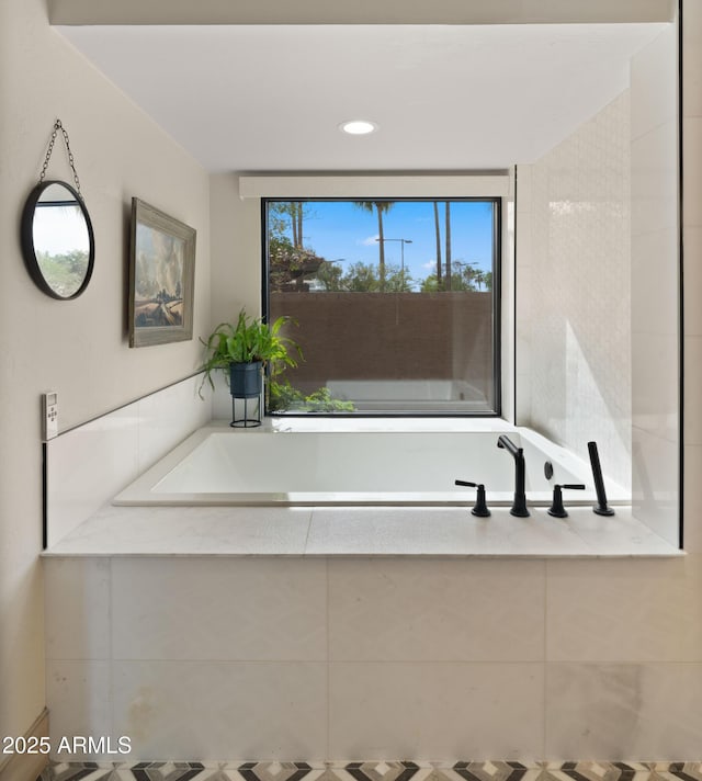 4450 E Camelback Rd Unit 4, Phoenix, AZ 85018 - bathroom featuring recessed lighting and a bath