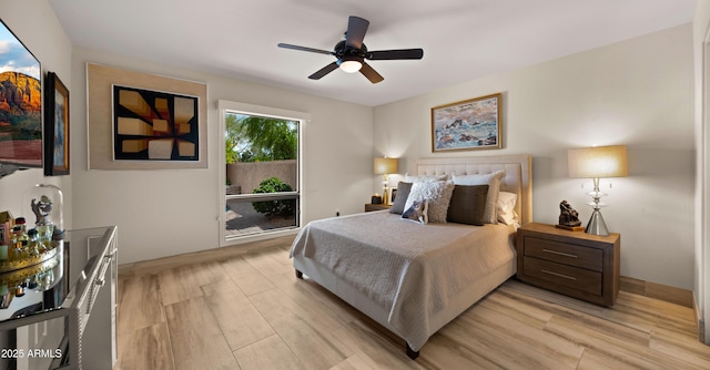 4450 E Camelback Rd Unit 4, Phoenix, AZ 85018 - bedroom with light wood-style flooring and ceiling fan