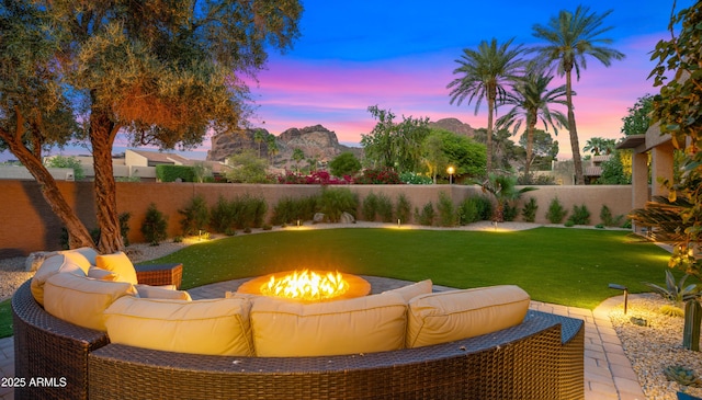 4450 E Camelback Rd Unit 4, Phoenix, AZ 85018 - exterior space with a fenced backyard and an outdoor living space with a fire pit