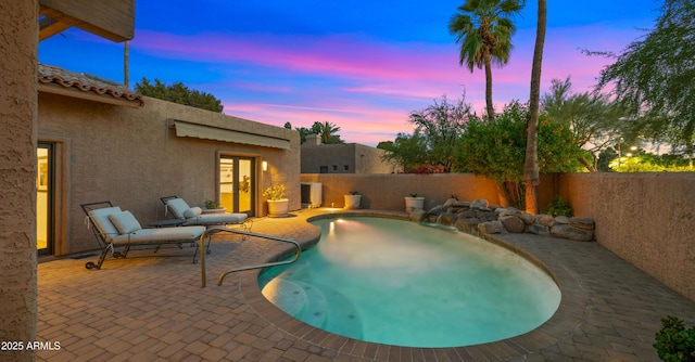 4450 E Camelback Rd Unit 4, Phoenix, AZ 85018 - view of swimming pool with a fenced backyard, a fenced in pool, a patio, and french doors