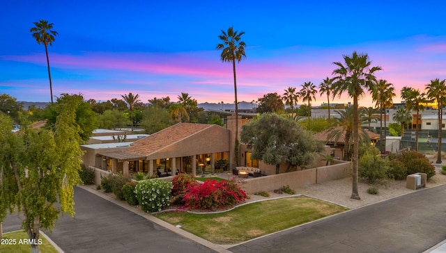 4450 E Camelback Rd Unit 4, Phoenix, AZ 85018 - property at dusk with fence