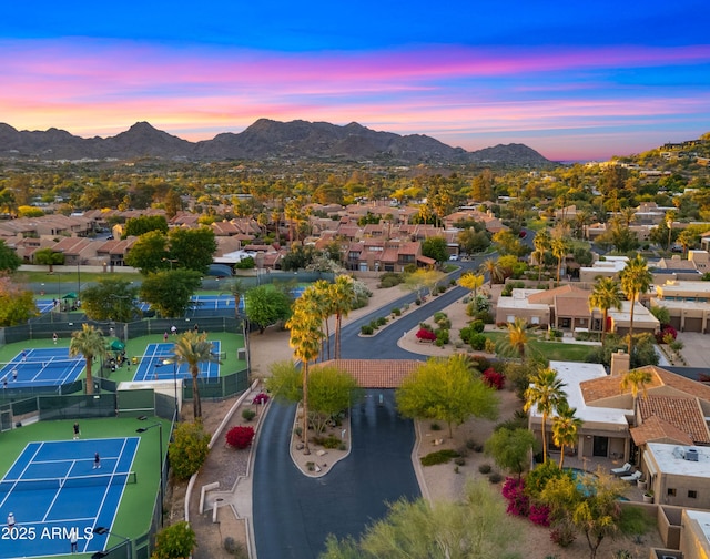 4450 E Camelback Rd Unit 4, Phoenix, AZ 85018 - aerial view at dusk featuring a mountain view and a residential view