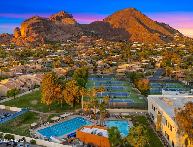4450 E Camelback Rd Unit 4, Phoenix, AZ 85018 - aerial view at dusk featuring a mountain view