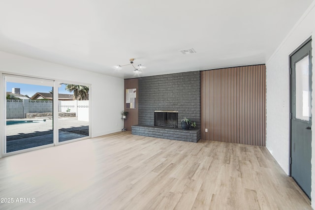 1653 E Palmcroft Dr, Tempe, AZ 85282 - unfurnished living room with wood finished floors and a fireplace