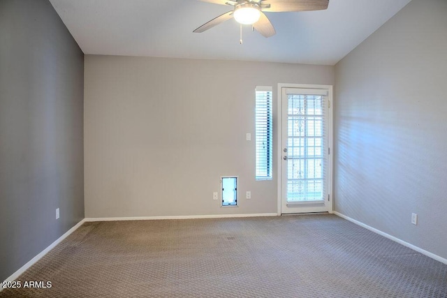 empty room featuring carpet floors and ceiling fan