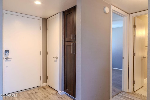 hallway featuring light hardwood / wood-style flooring