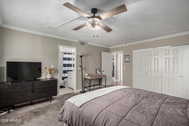 carpeted bedroom with ensuite bath, ceiling fan, and ornamental molding