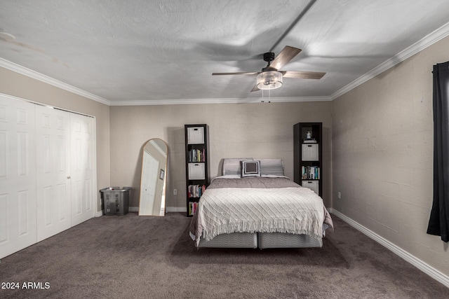 bedroom featuring dark colored carpet, ceiling fan, ornamental molding, a textured ceiling, and a closet