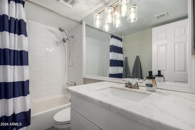 full bathroom featuring shower / bath combo with shower curtain, vanity, and toilet