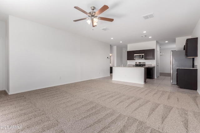 28259 N Chalcocite St, San Tan Valley, AZ 85143 - unfurnished living room with light colored carpet, ceiling fan, and recessed lighting