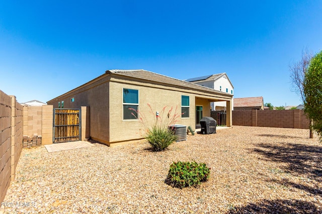 28259 N Chalcocite St, San Tan Valley, AZ 85143 - rear view of property featuring a gate, a fenced backyard, and stucco siding