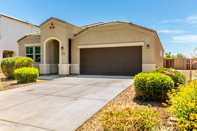 28259 N Chalcocite St, San Tan Valley, AZ 85143 - mediterranean / spanish-style house featuring a garage, stucco siding, driveway, and a tile roof