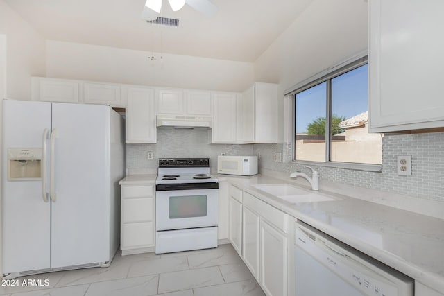 kitchen featuring white appliances, range hood, white cabinetry, and sink