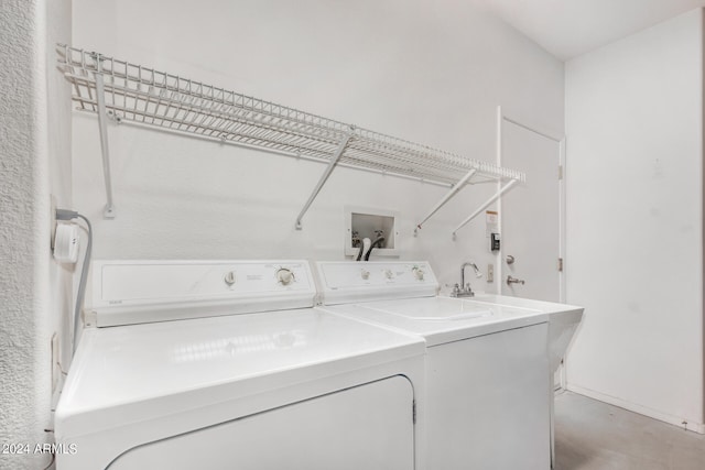 laundry room with washing machine and clothes dryer