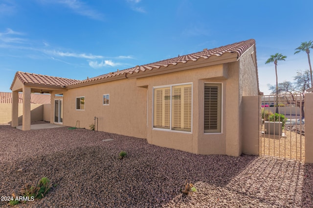 back of property featuring a patio area