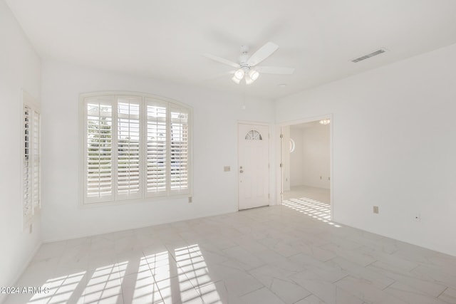 unfurnished room featuring ceiling fan