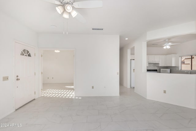 spare room featuring ceiling fan