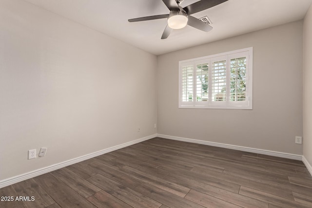 unfurnished room with baseboards, ceiling fan, dark wood-style floors, and visible vents