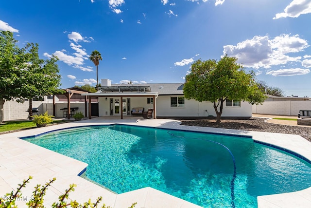 view of pool featuring a fenced in pool, a patio, and a fenced backyard