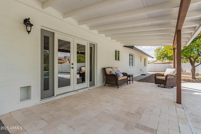view of patio with fence and french doors