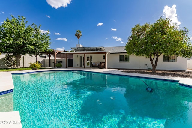 view of swimming pool with a patio, a fenced in pool, and fence