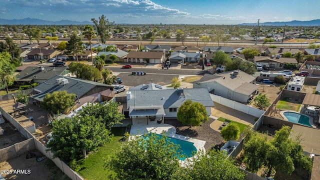 drone / aerial view with a residential view and a mountain view