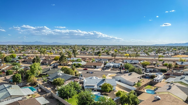 drone / aerial view with a residential view and a mountain view