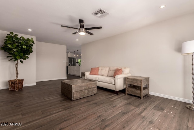 living area with ceiling fan, recessed lighting, baseboards, visible vents, and dark wood-style floors