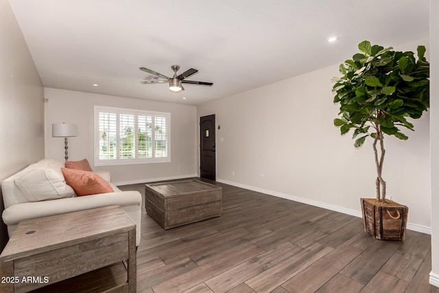 living room with baseboards, ceiling fan, recessed lighting, and wood finished floors