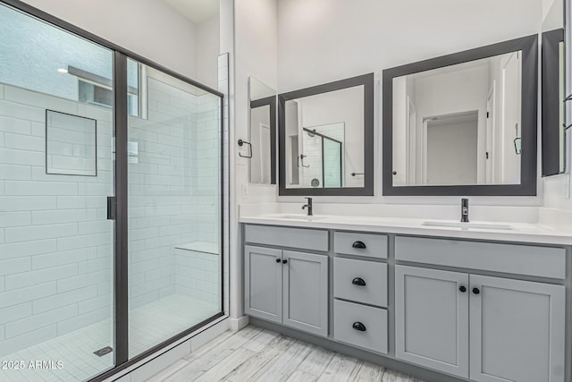 17322 W Puget Ave, Waddell, AZ 85355 - bathroom featuring double vanity and a stall shower